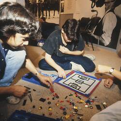 Digital Photograph -  Johnny Verikakis, Evan Robotis & Anthony Tulinos Creating a Soccer Pitch with LEGO, Sunrise School, Melbourne Museum, Russell Street, 1989