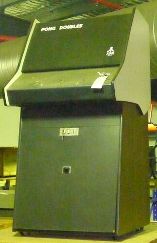 Black arcade video game console. With black cover over screen and control board.