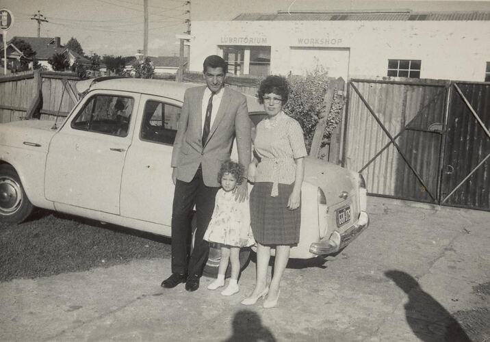 Digital Photograph - Man & Woman with Girl in front of Car, Front Yard, Oakleigh, 1962