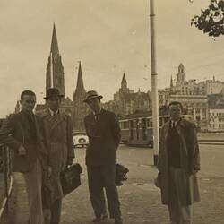 Digital Photograph - Four Men standing on St Kilda Road, near Princes Bridge, Melbourne, 1951