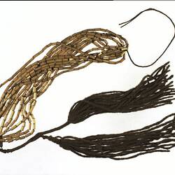 Neck ornament, reed necklace with two fur string tassels