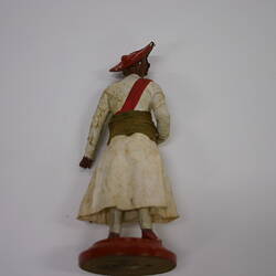 back of Indian dressed painted wooden figure