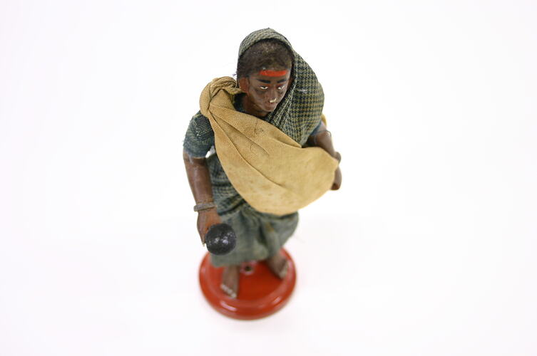 Indian Figure - Woman Wearing a Blue Check Sari, Clay