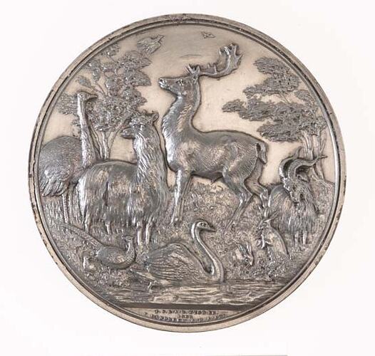 Engraved silver medal.