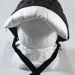 Black cloth pleated bonnet, with visor.