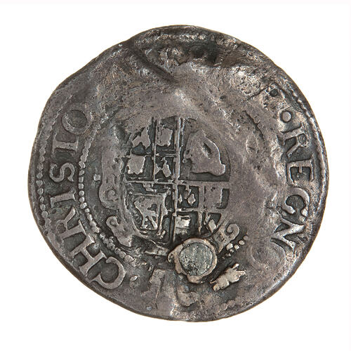 Coin, round, Within an inner beaded circle, a garnished, oval, quartered shield with plume at top.