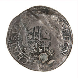 Coin, round, Within an inner beaded circle, a garnished, oval, quartered shield with plume at top.