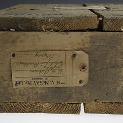 Detail of wooden crate with delivery tag.