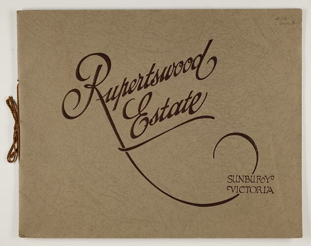 Front cover of a brochure, brown textured card with string binding.