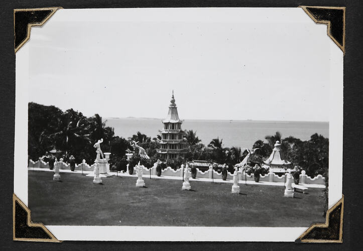 Pagoda and statues in garden.