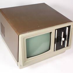 Brown box and tv screen computer.