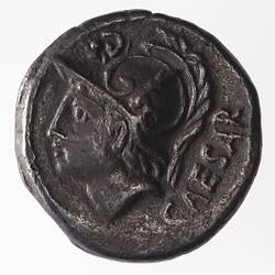 Round coin, aged, male helmeted profile, facing left.