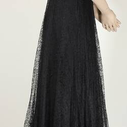 Side view, black, lace, floor length, floral dress.