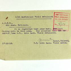 paper with printed text, red stamp mark in top-left corner and written text.