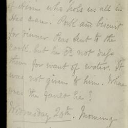 Open diary with handwritten text on discoloured worn page.