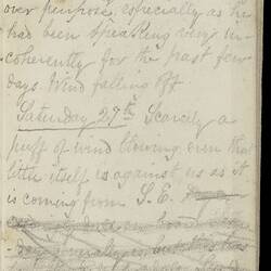 Open diary with handwritten text on discoloured worn page.