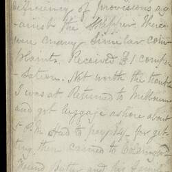 Open diary with handwritten text on discoloured worn page.