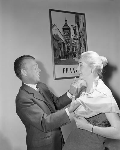 Man Adjusting a Woman's scarf, Victoria, 27 Jul 1959