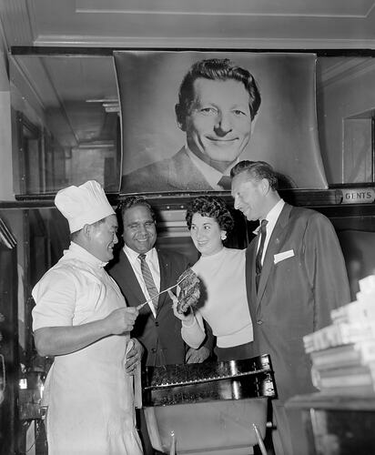 James McEwan & Co, Group Standing with a Barbecue, Hotel Cecil, Victoria, 15 Oct 1959