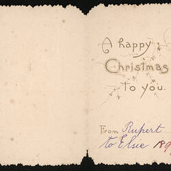 Card with printed text reading 'HAPPY CHRISTMAS TO YOU' with handwritten signature.
