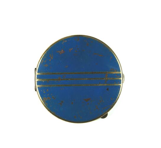 Front of blue powder compact.