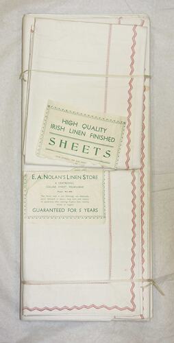 Front of bundle of sheets with labels.