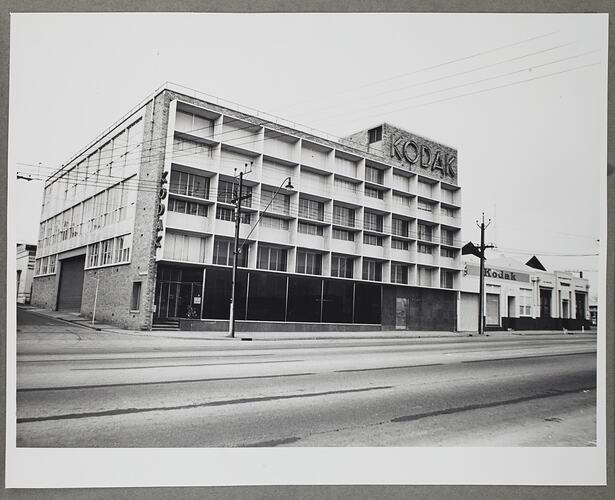 Street view of a multi-storey Kodak branded building.