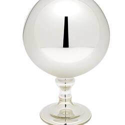 Mirrored glass globe on glass stand.