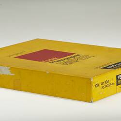 Side view of rectangular yellow box with Kodak logo.