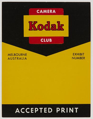 Rectangular yellow and black label with red, white and black printed text.