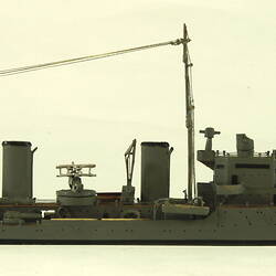 Naval ship with two masts, facing right.