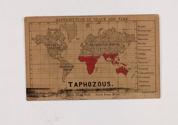 Retangular brown card with black and red text and map