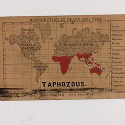Retangular brown card with black and red text and map