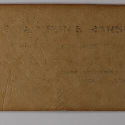 Back of off-white rectangular label.