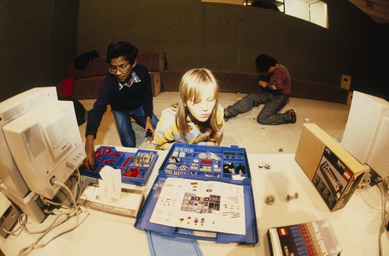 A students playing with Lego.