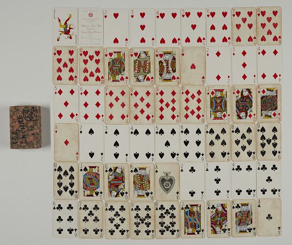 Deck of cards laid out showing all cards in hearts, diamonds, spades and clubs.