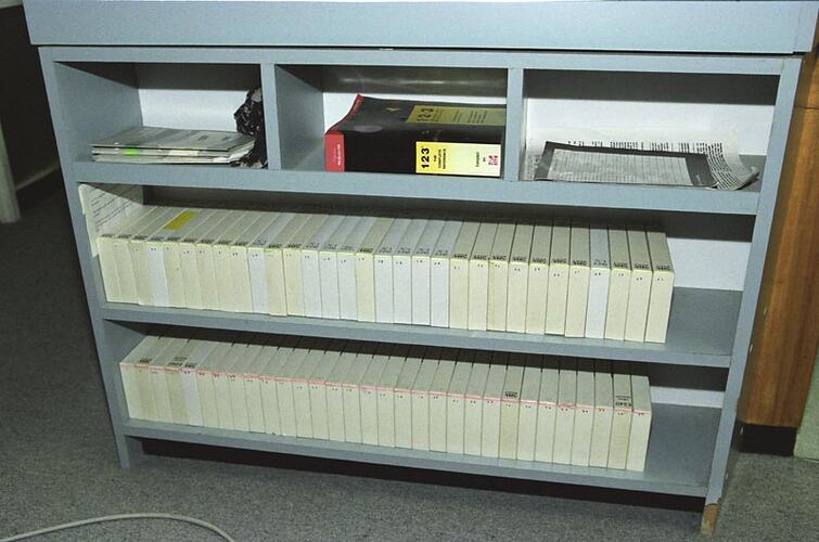 Shelves with documents and video cassettes