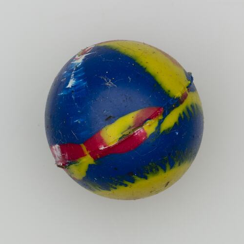 Blue ball with red and yellow swirl markings.