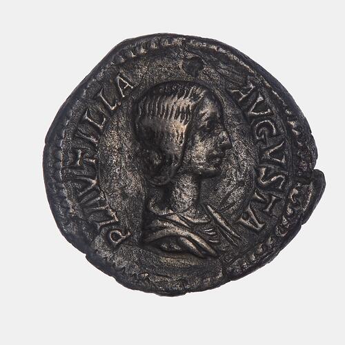 Roughly round silver coin. Draped bust of woman facing right. Text around.