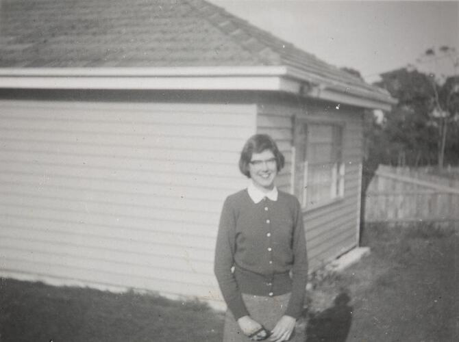 Digital Photograph - Woman Standing in Front Garden of New House, Mount Waverley, 1956