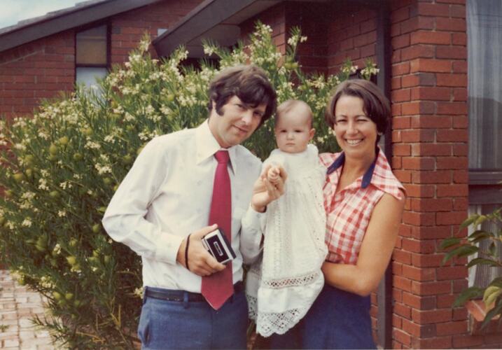 Digital Photograph - Man, Woman & Baby in Christening Gown, Front Garden, Cheltenham, 1976
