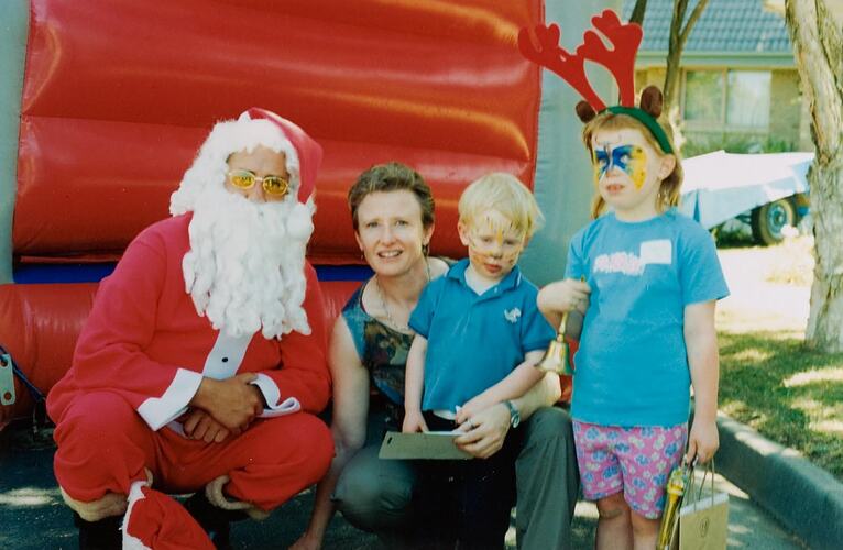 Digital Photograph - Santa Claus with Woman, Boy & Girl, Christmas Street Party, Vermont, 2000