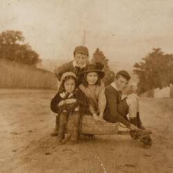 Digital Photograph - Two Boys & Two Girls Crowded onto Wooden Billy Cart on Street, Malvern, 1912