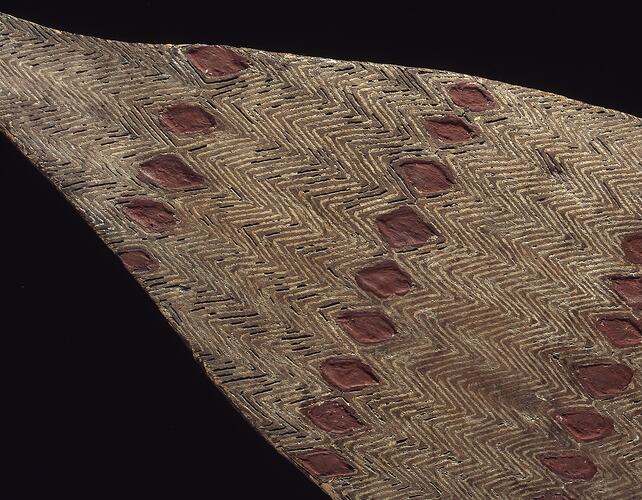 Detail of pointed end of wooden shield.