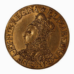 Coin, round, Crowned bust of the Queen, wearing ruff and embroidered dress facing left; text around.