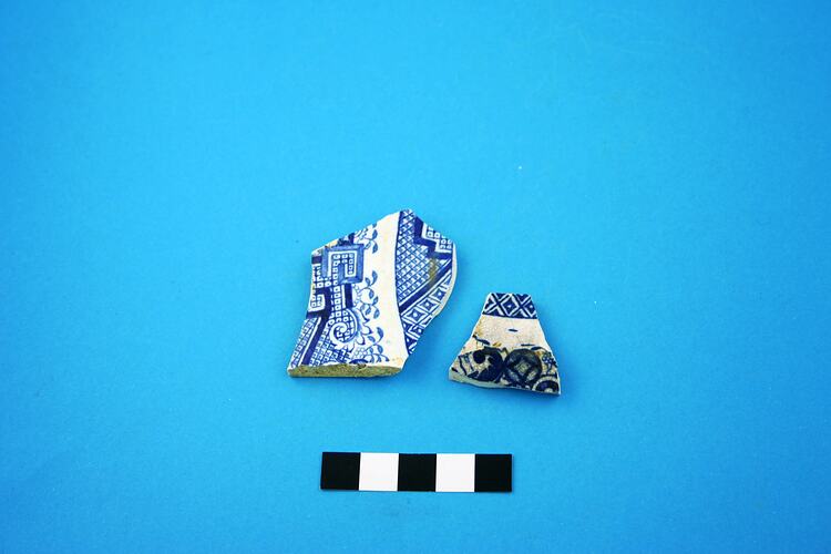 Two earthenware plate fragments.