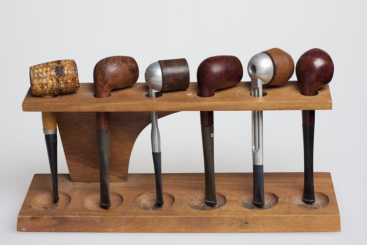 Set of six wooden smoking pipes.