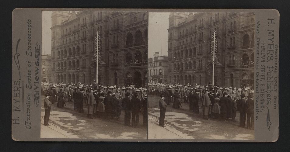 Crowd gathered outside building.