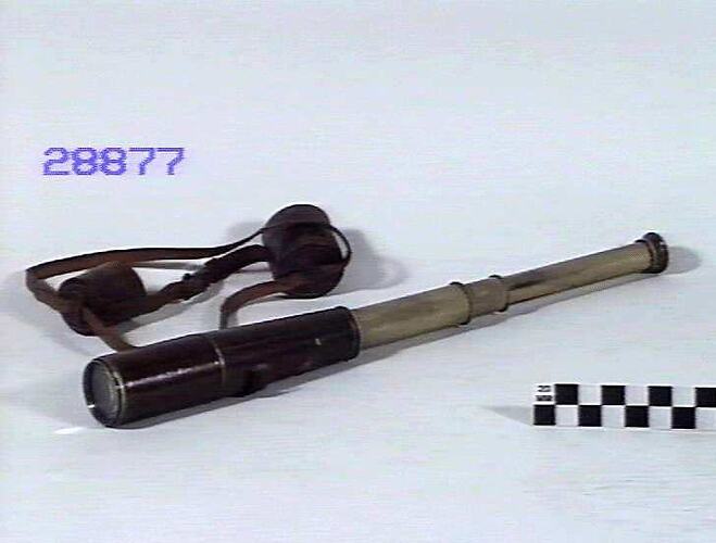 Brass telescope, extended, and with case.
