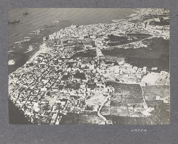 Aerial view of a city in along a coastline.
